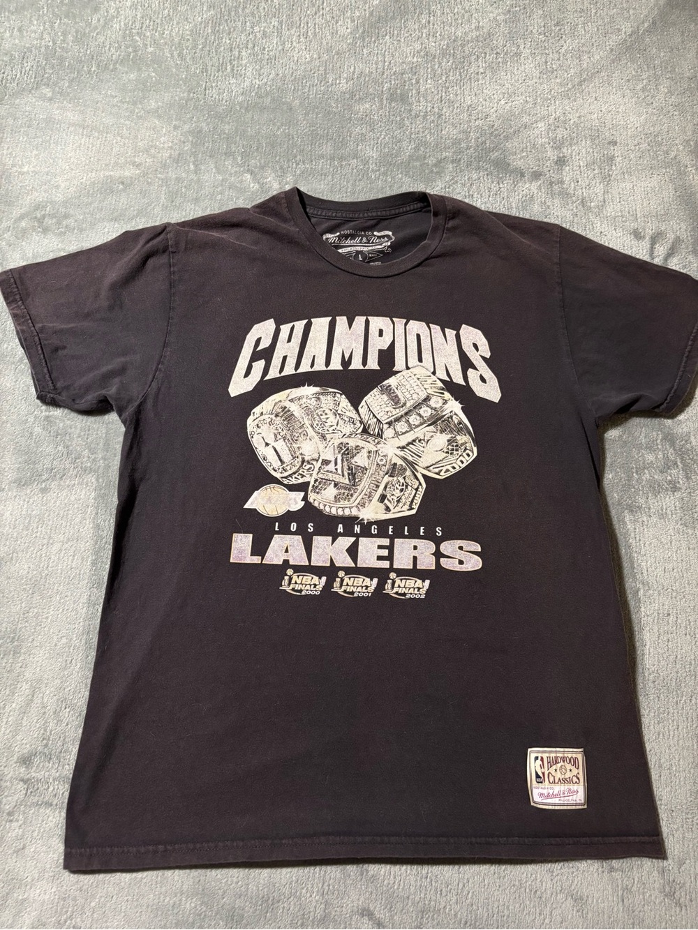 Mitchell & Ness Black Los Angeles Lakers "Champions" Short Sleeve Tee